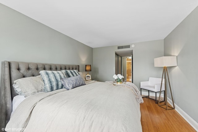 260 E Chestnut St Unit 3303, Chicago, IL 60611 - bedroom featuring light wood-style flooring and baseboards
