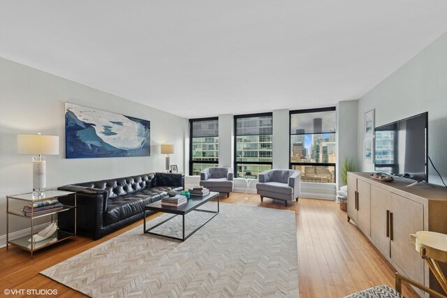 260 E Chestnut St Unit 3303, Chicago, IL 60611 - living room with healthy amount of natural light and light wood-type flooring