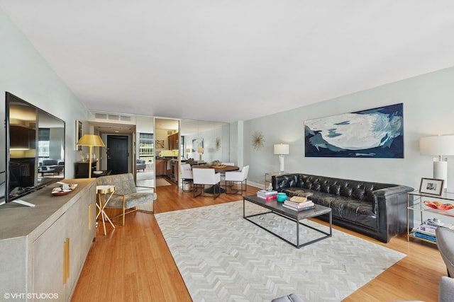 260 E Chestnut St Unit 3303, Chicago, IL 60611 - living area featuring light wood finished floors