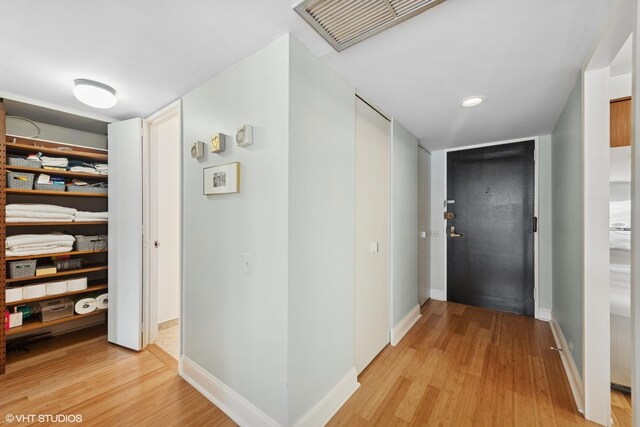 260 E Chestnut St Unit 3303, Chicago, IL 60611 - hall with light wood finished floors