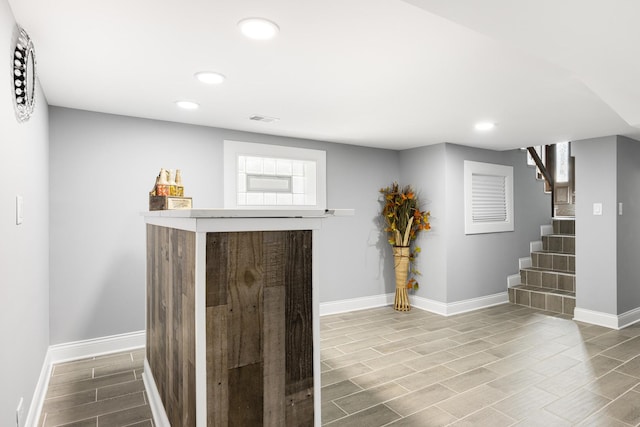 12349 S Parnell Ave, Chicago, IL 60628 - indoor dry bar with wood finish floors, recessed lighting, and stairs