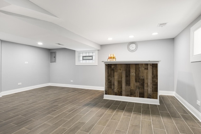 12349 S Parnell Ave, Chicago, IL 60628 - basement with a bar, dark wood-style floors, recessed lighting, and electric panel