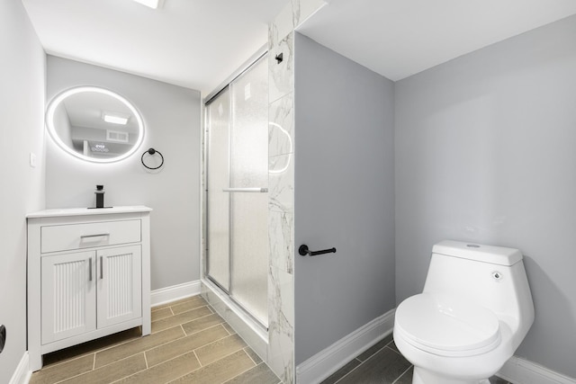 12349 S Parnell Ave, Chicago, IL 60628 - bathroom with wood tiled floors, vanity, and a stall shower