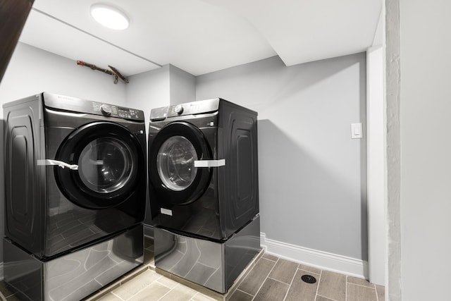 12349 S Parnell Ave, Chicago, IL 60628 - laundry area featuring washer and clothes dryer and wood finish floors