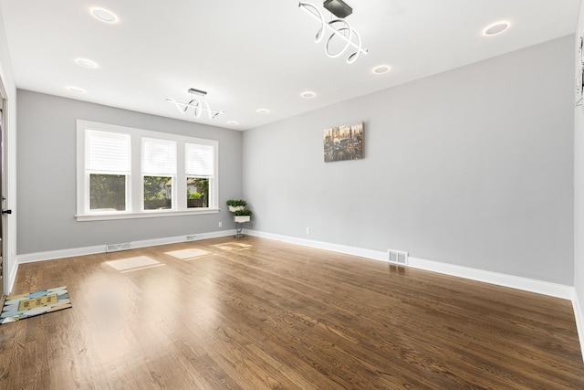 12349 S Parnell Ave, Chicago, IL 60628 - empty room with wood finished floors and recessed lighting