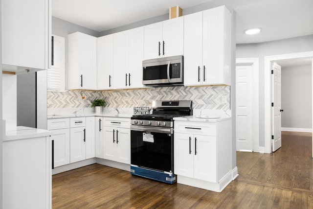 12349 S Parnell Ave, Chicago, IL 60628 - kitchen featuring stainless steel appliances, dark wood-style floors, backsplash, white cabinetry, and recessed lighting