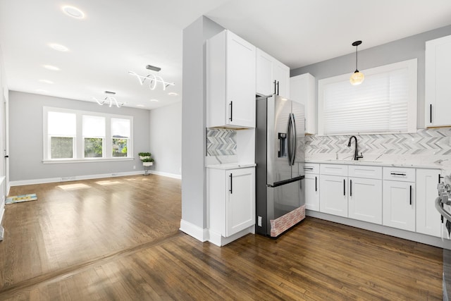 12349 S Parnell Ave, Chicago, IL 60628 - kitchen featuring stainless steel fridge, backsplash, open floor plan, white cabinetry, and dark wood-style flooring