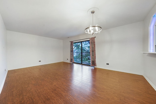 5200 N Rockwell St Unit 3N, Chicago, IL 60625 - unfurnished room with a chandelier and wood finished floors