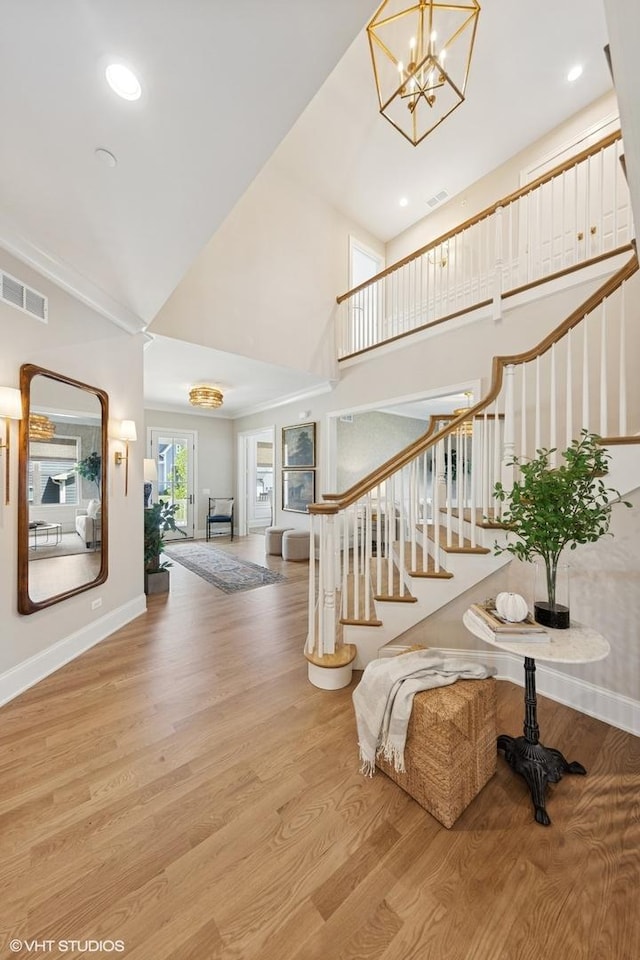 1120 Pin Oak Dr, Western Springs, IL 60558 - entrance foyer with stairway, wood finished floors, a chandelier, a towering ceiling, and recessed lighting