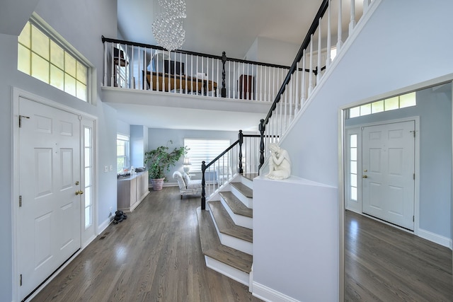 3142 Bennett Pl, Aurora, IL 60502 - foyer with a towering ceiling, stairway, wood finished floors, and a chandelier