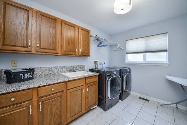 3142 Bennett Pl, Aurora, IL 60502 - laundry area with cabinet space, independent washer and dryer, and light tile patterned flooring