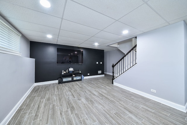 3142 Bennett Pl, Aurora, IL 60502 - unfurnished living room with wood finished floors, stairs, and a paneled ceiling