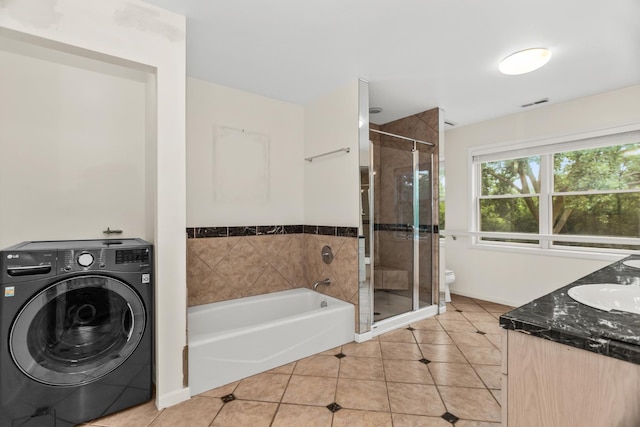 806 Lawler Ave, Wilmette, IL 60091 - bathroom with washer / dryer, a shower stall, tile patterned floors, a bath, and vanity