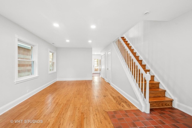 4721 S Woodlawn Ave Unit E, Chicago, IL 60615 - unfurnished living room with stairs, recessed lighting, and wood finished floors