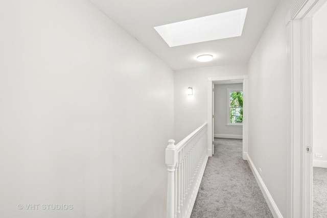 4721 S Woodlawn Ave Unit E, Chicago, IL 60615 - corridor featuring a skylight, carpet floors, and an upstairs landing