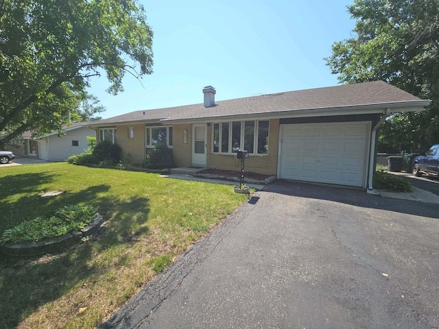 75 Bode Rd, Hoffman Estates, IL 60169 - ranch-style home featuring a garage, a chimney, a front yard, asphalt driveway, and brick siding