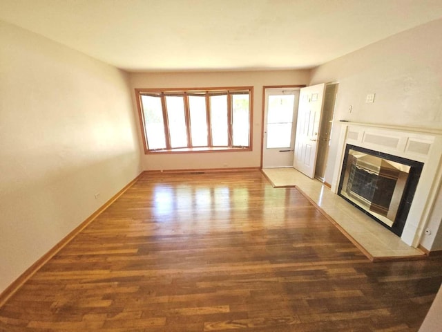 75 Bode Rd, Hoffman Estates, IL 60169 - unfurnished living room featuring wood finished floors and a tiled fireplace