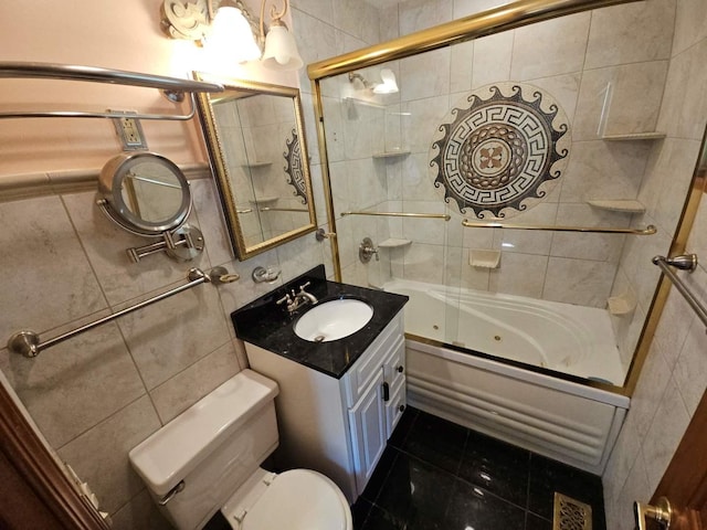 75 Bode Rd, Hoffman Estates, IL 60169 - full bathroom featuring tile walls, a combined bath / shower with jetted tub, vanity, and tile patterned flooring