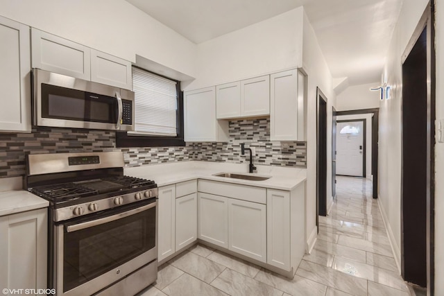 7226 S Rhodes Ave, Chicago, IL 60619 - kitchen with stainless steel appliances, light countertops, backsplash, and light marble finish floors