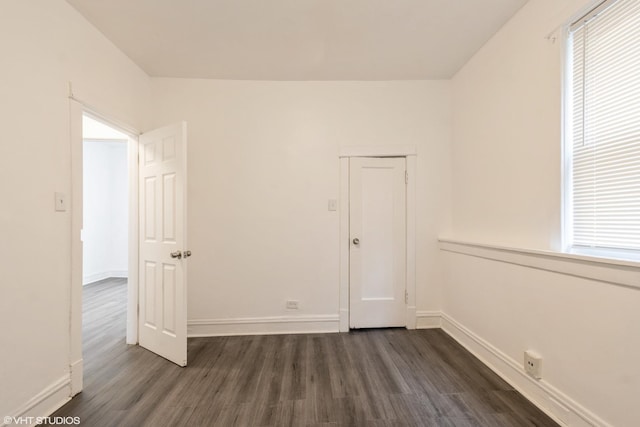 7226 S Rhodes Ave, Chicago, IL 60619 - spare room featuring dark wood-style flooring and healthy amount of natural light