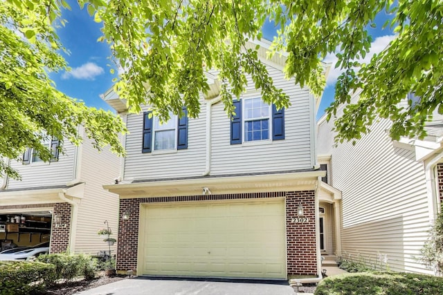 2302 Sandy Creek Dr, Algonquin, IL 60102 - view of front of house with brick siding, a garage, and driveway