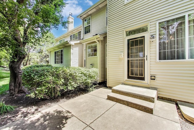 2302 Sandy Creek Dr, Algonquin, IL 60102 - entrance to property featuring a chimney and a patio