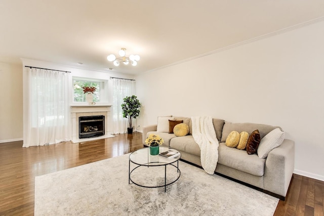 2302 Sandy Creek Dr, Algonquin, IL 60102 - living area featuring wood finished floors, crown molding, a tile fireplace, and a chandelier