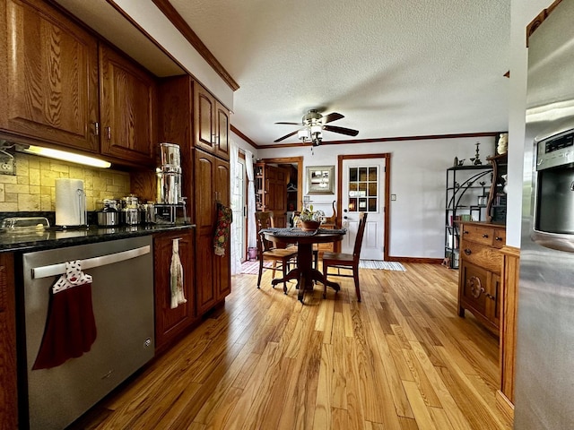 6119 Little Galilee Rd, Clinton, IL 61727 - kitchen with stainless steel dishwasher, crown molding, light wood-type flooring, a ceiling fan, and dark countertops