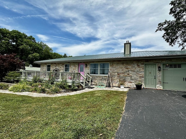 6119 Little Galilee Rd, Clinton, IL 61727 - ranch-style house with a chimney, stone siding, a metal roof, a front yard, and a standing seam roof
