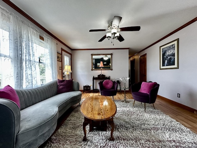 6119 Little Galilee Rd, Clinton, IL 61727 - living area featuring ornamental molding, wood finished floors, and a ceiling fan