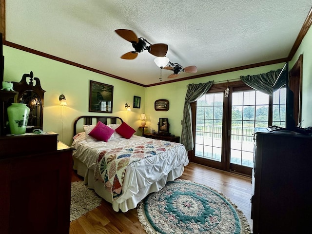 6119 Little Galilee Rd, Clinton, IL 61727 - bedroom featuring access to exterior, wood finished floors, ornamental molding, a textured ceiling, and a ceiling fan