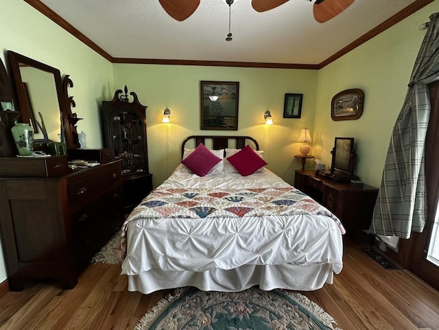 6119 Little Galilee Rd, Clinton, IL 61727 - bedroom with wood finished floors, ornamental molding, and a ceiling fan