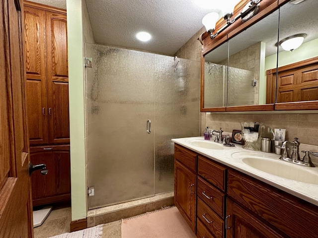 6119 Little Galilee Rd, Clinton, IL 61727 - full bath featuring a textured ceiling, a stall shower, double vanity, and backsplash