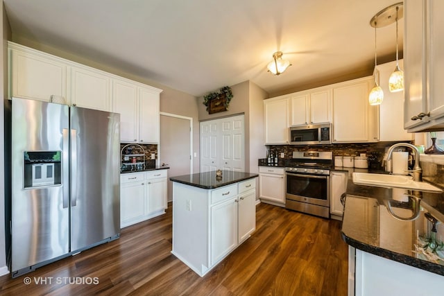 1550 W Ludington Cir, Romeoville, IL 60446 - kitchen featuring stainless steel appliances, decorative backsplash, dark wood finished floors, and white cabinets