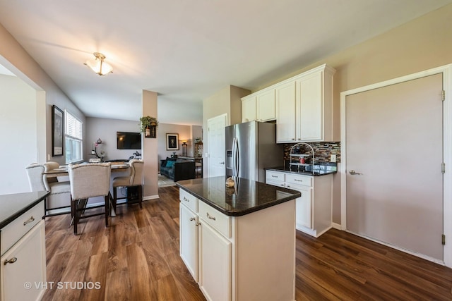 1550 W Ludington Cir, Romeoville, IL 60446 - kitchen featuring stainless steel fridge with ice dispenser, dark wood-style floors, decorative backsplash, and white cabinets