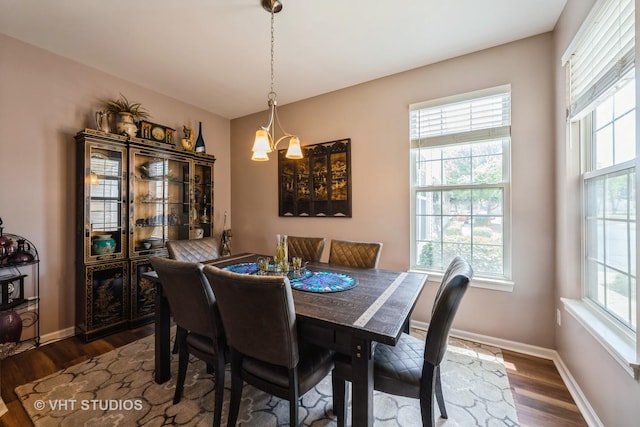 1550 W Ludington Cir, Romeoville, IL 60446 - dining room featuring dark wood finished floors and baseboards