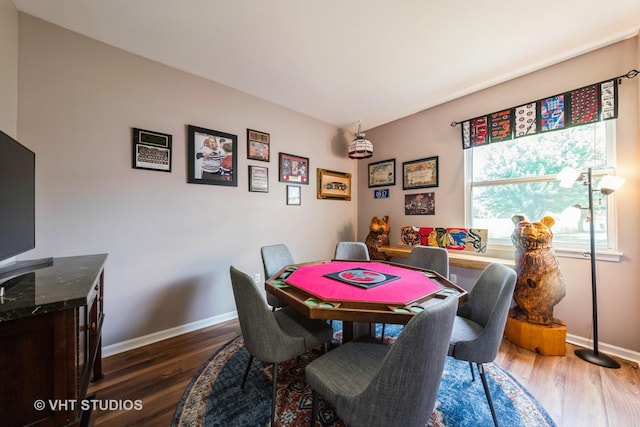 1550 W Ludington Cir, Romeoville, IL 60446 - dining area with dark wood-style floors and baseboards