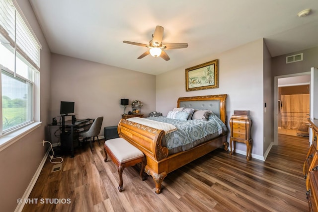 1550 W Ludington Cir, Romeoville, IL 60446 - bedroom with wood finished floors, multiple windows, and ceiling fan