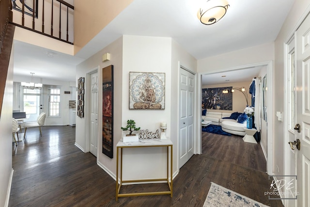 3730 Baybrook Dr, Aurora, IL 60504 - hallway featuring dark wood-style flooring and a chandelier