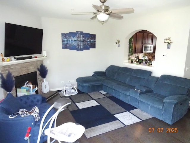 1108 Evergreen Ave, Des Plaines, IL 60016 - living room with a ceiling fan, a fireplace, and arched walkways