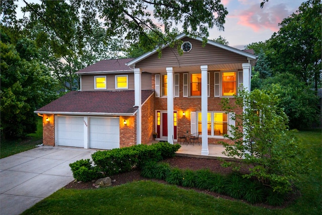1386 Old Dominion Ct, Naperville, IL 60540 - neoclassical home with concrete driveway, brick siding, covered porch, a lawn, and an attached garage