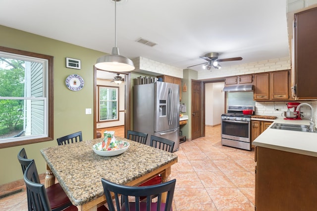 1386 Old Dominion Ct, Naperville, IL 60540 - kitchen featuring appliances with stainless steel finishes, ceiling fan, under cabinet range hood, and light countertops
