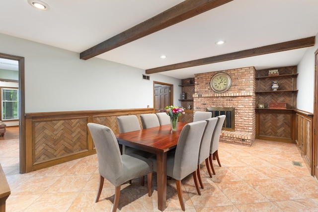 1386 Old Dominion Ct, Naperville, IL 60540 - dining room with beamed ceiling, recessed lighting, wainscoting, a brick fireplace, and light tile patterned floors