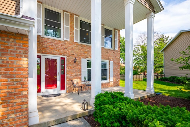 1386 Old Dominion Ct, Naperville, IL 60540 - view of exterior entry featuring brick siding and a porch