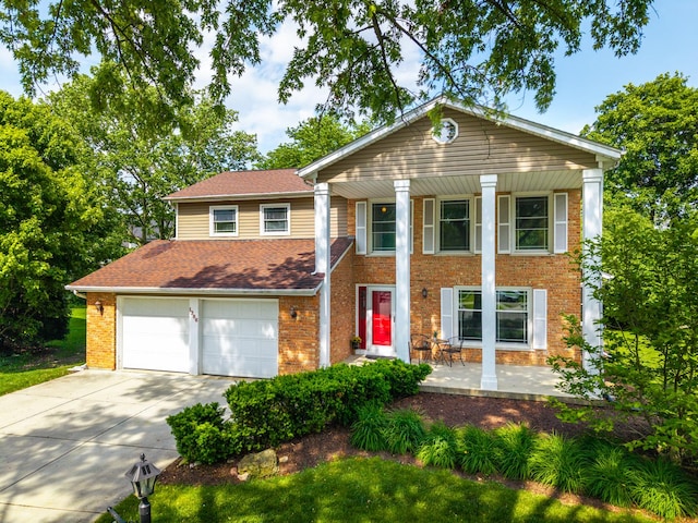 1386 Old Dominion Ct, Naperville, IL 60540 - greek revival inspired property featuring concrete driveway, a porch, brick siding, a garage, and a shingled roof