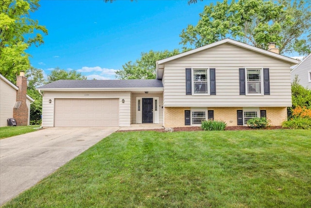 1259 Durham Dr, Wheaton, IL 60189 - tri-level home with an attached garage, concrete driveway, a front lawn, and a chimney