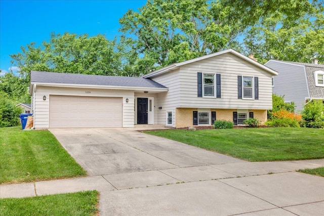 1259 Durham Dr, Wheaton, IL 60189 - split level home featuring a garage, concrete driveway, a front lawn, and brick siding