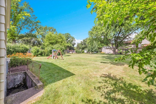 1259 Durham Dr, Wheaton, IL 60189 - view of grassy yard with a playground