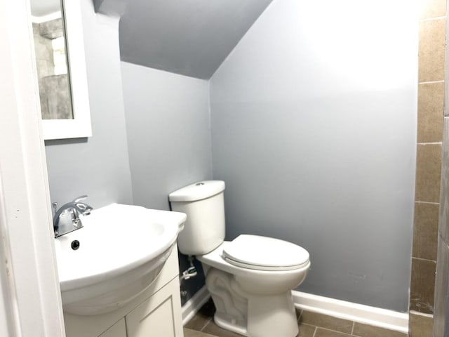 8517 S Wallace St, Chicago, IL 60620 - bathroom with lofted ceiling, vanity, and tile patterned floors