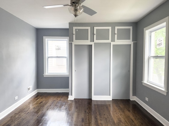 8517 S Wallace St, Chicago, IL 60620 - unfurnished bedroom with dark wood-type flooring and a ceiling fan